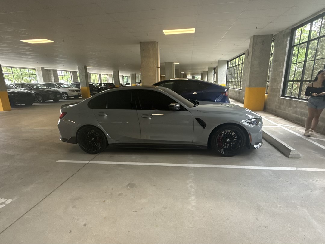 2024 BMW M3 full side profile in Skyscraper Gray Metallic on gloss black M wheels